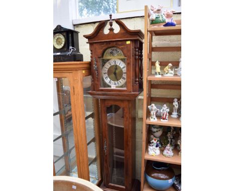 A reproduction longcase clock.