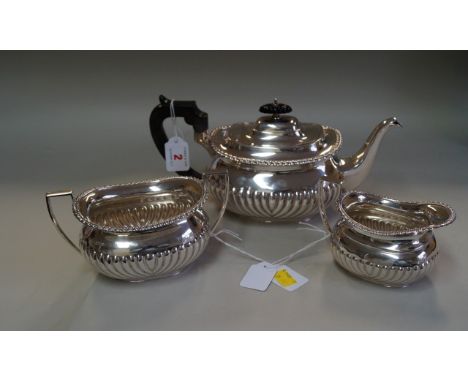 A late Victorian silver three piece teaset, by Mappin Bros, Sheffield 1900 & 1901, in the Regency style with gadrooned decora