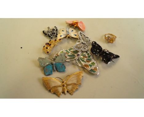 A collection of butterfly brooches;  together with two butterfly pendants; and a glass set butterfly ring. [11]