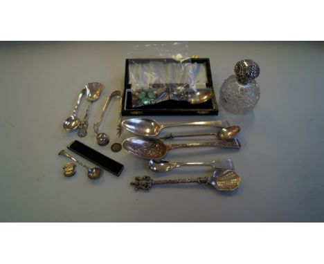 A mixed group of silver, to include: a silver mounted cut glass scent bottle; a napkin ring, (a.f.); nine spoons, (one in cas