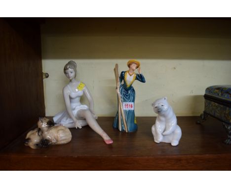 A Lladro polar bear; together with a Goebel figure of 'River Outing 1889'; a Beswick group of two cats, model 1296; and a fig