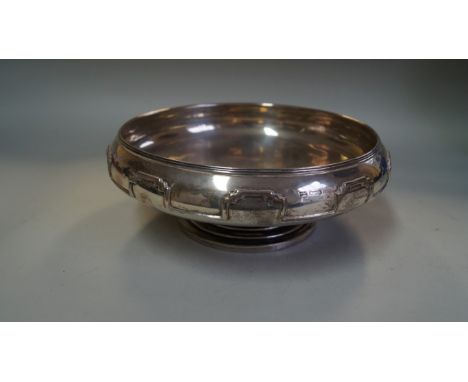 A silver circular pedestal bowl, by Walker & Hall, Sheffield 1933, with moulded geometric decoration to the edge, 24cm diamet