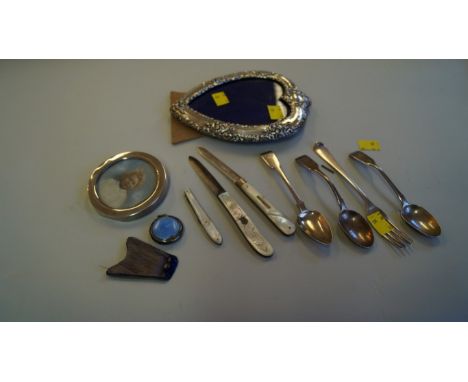 A silver heart shaped easel back photograph frame; together with another silver circular small photograph frame; two silver b
