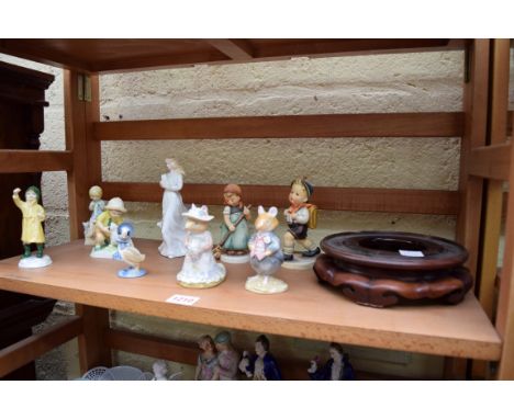 Three Royal Worcester figures, by F G Doughty; together with a Royal Doulton figure of 'Loving You', HN3389; two Hummel figur