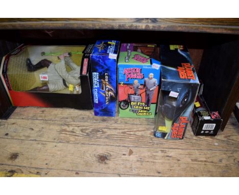 A Star Wars Qui-gon Jinn collectable figure, boxed; together with a Star Wars wristwatch, in light sabre box; and three other