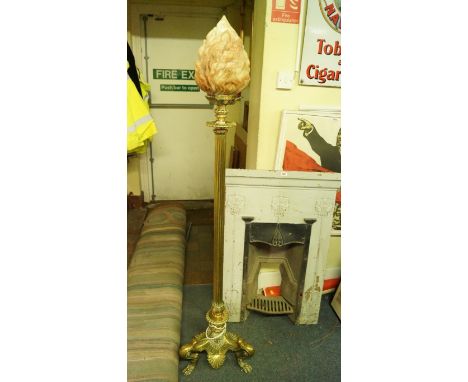 An antique cast brass standard lamp, with a carved alabaster flame form shade, total height 161cm. 