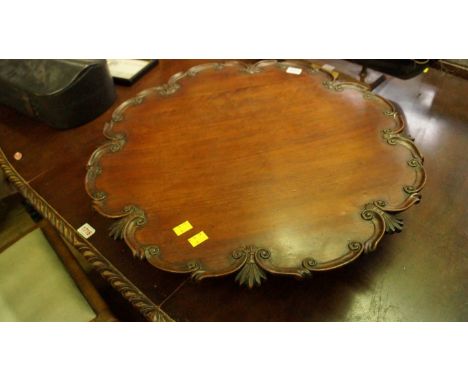 An old mahogany Lazy Susan, the single piece top with piecrust edge, 61cm wide.  Condition Report: Condition is commensurate 