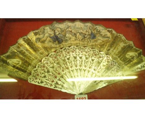 A mother of pearl and watercolour painted fan, with gilt highlights, the guard 27.5cm long, in a glazed case. 