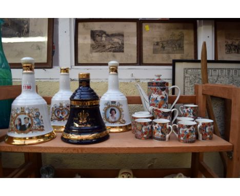 Four Wade Bells whisky decanters, (one lacking contents); together with an Oriental coffee service. 