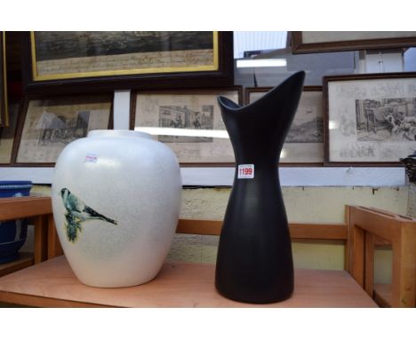 A 1950s Poole pottery vase; together with another Poole pottery ovoid vase, former 36cm high.  Condition Report: No visible c