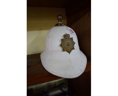 A Royal Marines pith helmet, by Cromwell, with Gibraltar brass badge to front. 