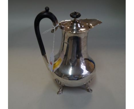 An Edwardian silver hot water pot, by Roberts & Belk, Sheffield 1909, of baluster form, on four cabriole feet, 18.5cm high, 4