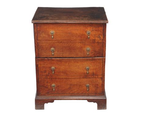 An oak box commode, late  18th/ early 19th century, the hinged action fronted by false drawers, fitted interior, 76cm high, 5