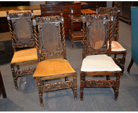 A set of four walnut side chairs in the 17th century style, with caned backs and seats on bobbin turned legs and stretchers, 
