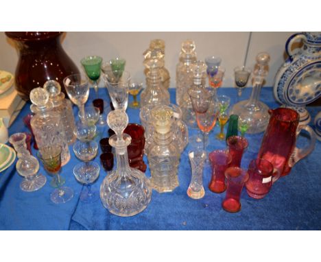 An assortment of clear and coloured glass, including a Bohemian ruby flashed and engraved goblet, etc.  
