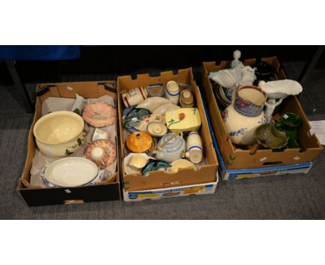 A mixed assortment of ceramics including Westminster pigs, two Poole pottery dolphins and other assorted pieces (3 boxes) 