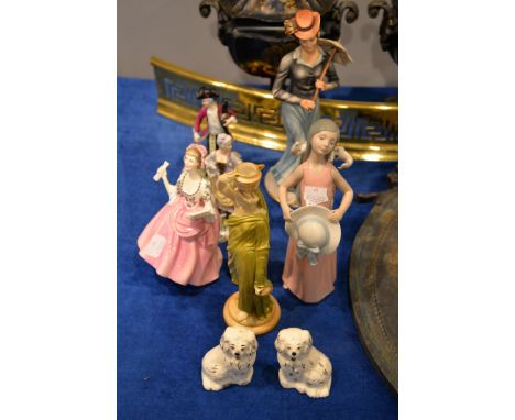 A Royal Worcester blush ivory figure of watercarrier and a Royal Doulton figure, The Ballad Seller, HN 2266, and a pair of Be