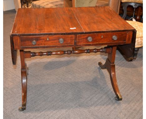 A Regency mahogany sofa table, the moulded rectangular twin top above two drawers on rectangular trestle end supports joined 