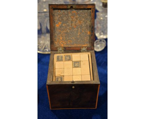A George III mahogany tea caddy, of square form, containing a quantity of letters, 11cm high 