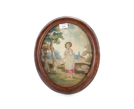 OVAL SILK EMBROIDERED PANEL 18TH / 19TH CENTURY depicting a young girl holding a bough, within a woodland setting, in carve r