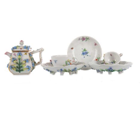 CONTINENTAL PORCELAIN MINIATURE TEA SET, LATE 19TH CENTURY comprising teapot, one larger and two smaller teacups and saucers,