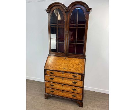 GEORGIAN WALNUT BUREAU BOOKCASE, the superstructure with double domed top over astragal glazed doors enclosing three shelves,