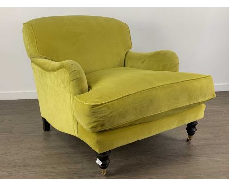 IN THE MANNER OF HOWARD & SONS, ARMCHAIR CONTEMPORARY deep seated, upholstered in a lime green fabric, on turned legs with br