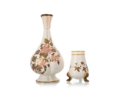 ROYAL WORCESTER, TWO AESTHETIC PERIOD VASES, LATE 19TH CENTURY both decorated with trailed foliage to an ivory ground, the fi