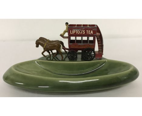 A circa 1960's Wade green ceramic pin tray mounted with Matchbox diecast vehicle.Matchbox Yesteryear Y12-1 Horse drawn bus wi