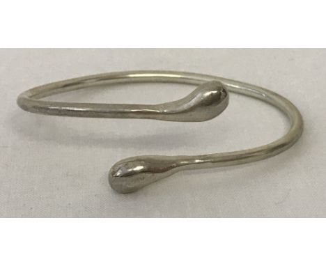 A modern design twist bangle. Marked 925.Total weight approx. 16g.