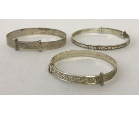 3 silver children's extending christening bracelets.One marked "silver" with engine turned decoration, one marked "ster silve