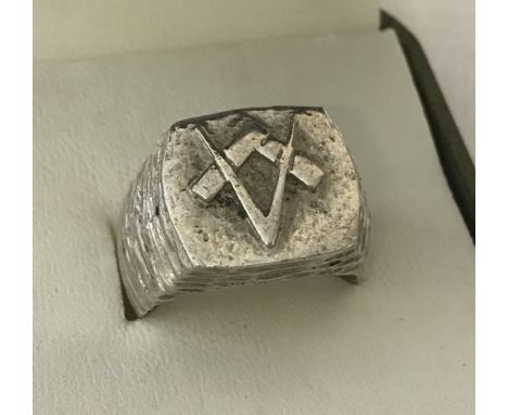 A men's heavy white metal ring with Masonic square and compass design to top.Total weight 17.9g.Size S 1/2.