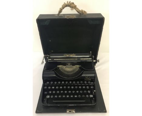 A cased Olympia Progress vintage typewriter.