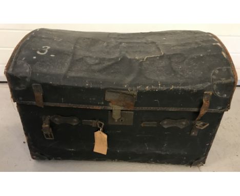 A large vintage  canvas and leather travelling trunk by B.Barrett Bros, Oxford Street, London.Luggage providers to the Royal 