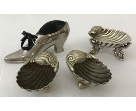 4 small silver plated items; a shoe shaped pin cushion together with 3 decorative salts.A pair of c.1890's scallop shaped sal