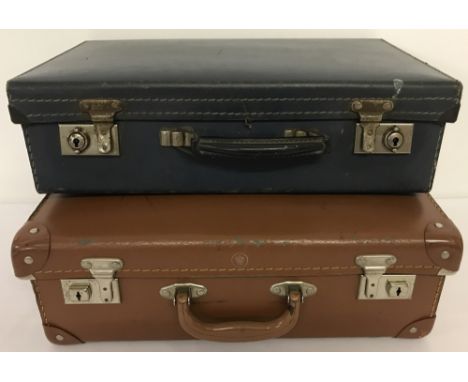 2 small vintage suitcases.A small brown case with Cheney locks and crown logo together with a small blue British made case.La