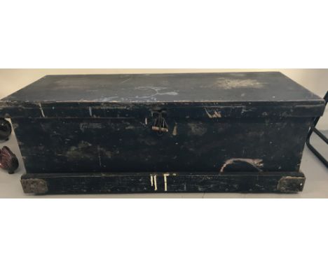 A vintage pine tool chest with metal banded bottom corners and interior tool shelf.Approx. 31cm x 90cm x 37cm.