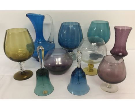 10 pieces of vintage and retro coloured glass wear.To include a teal coloured jug, vases, Bohemia glass hand bells and large 