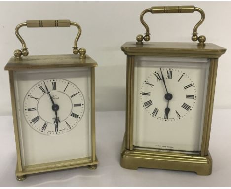2 vintage heavy brass quartz carriage clocks.A Weiss, Made in England clock with roman numeral markers together with a Swiss 