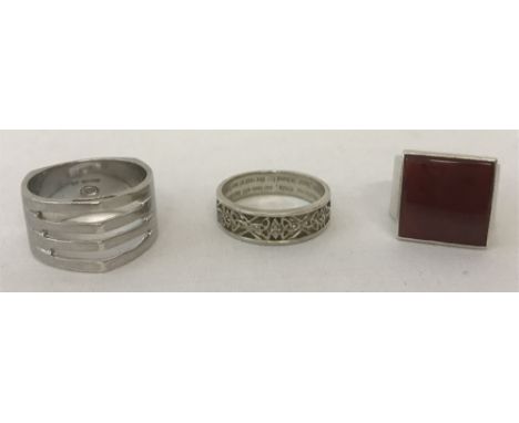 3 modern design rings.Comprising, a contemporary cathedral design ring hallmarked Sheffield 2004, a band ring with Celtic des