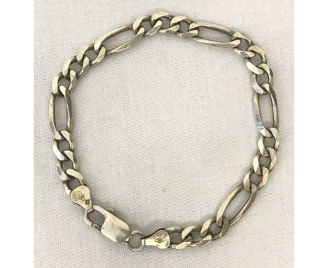 A silver Figaro design bracelet with lobster clasp.Clasps and fixings marked 925 with scales mark. Makers mark I.B.B to both 