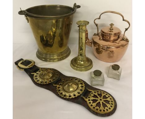 A collection of vintage brass and copper ware.Comprising: a brass milk pail, a copper kettle, a brass candlestick with pusher