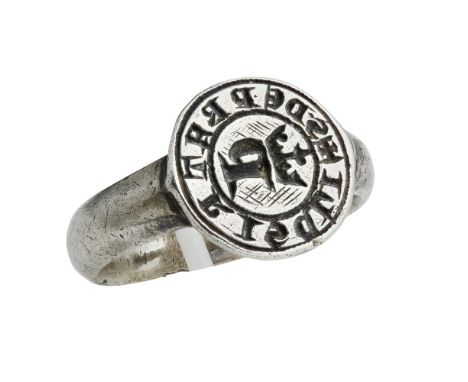 A seal ring, probably Medieval  the circular matrix incised with initial P below a coronet within inscription, apparently unm