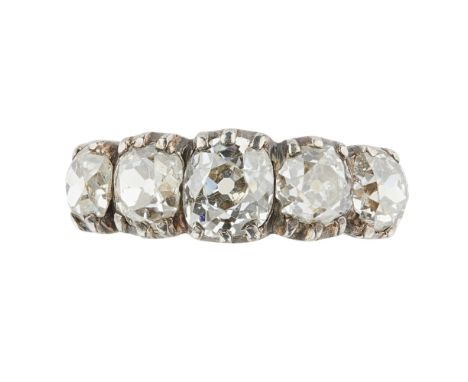 A late 19th century five stone diamond ring  claw set with five graduated old cushion cut diamonds, to a plain yellow metal s