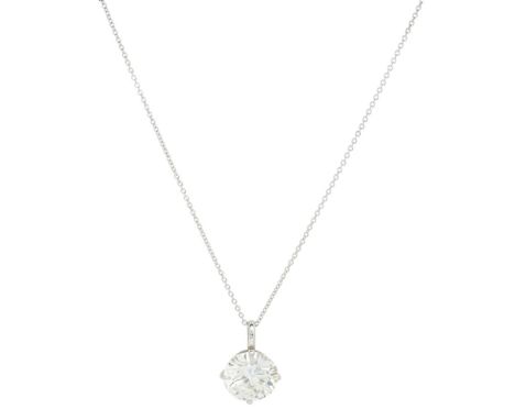 A single stone diamond set pendant  claw set with a single round brilliant cut diamond, to a plain 9ct white gold trace link 