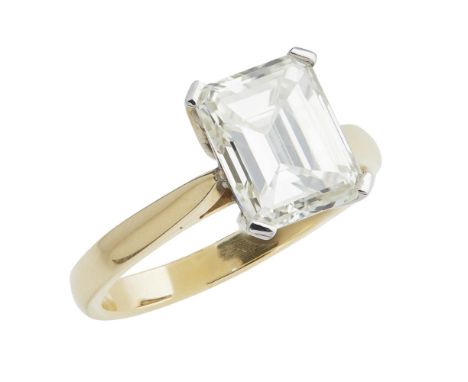 A single stone diamond ring  claw set with a single emerald cut diamond, to a plain 18ct shank; with accompanying report by t