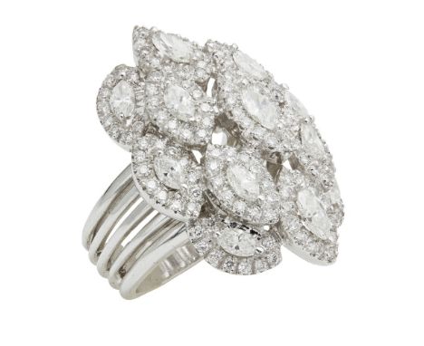 A diamond cocktail ring  formed as a floral cluster of thirteen marquise brilliant cut diamonds with pavé set diamond haloes 