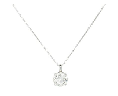 A single stone diamond set pendant  claw set with a single round brilliant cut diamond, to a 9ct white gold trace link chain;