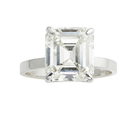 A single stone diamond set ring  claw set with a single emerald cut diamond, to a plain unmarked shank; with accompanying GIA