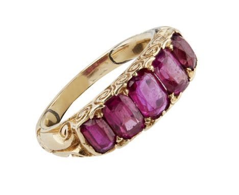 A late Victorian ruby set ring  claw set with five oval cut rubies, the gallery with scrolling detail, to a plain unmarked ye